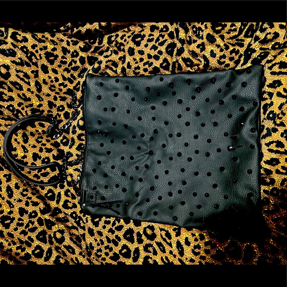 Black vegan leather studs purse with tie-die green liner.